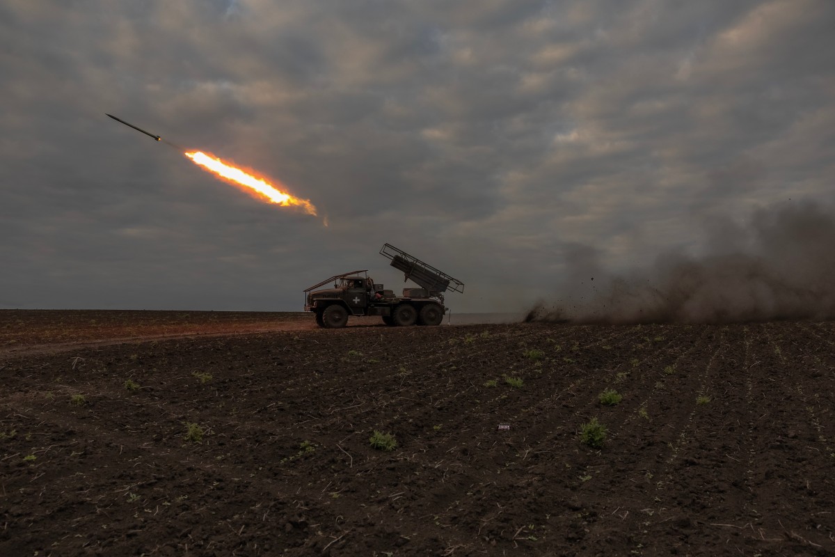 Ukrainian servicemen of the 92nd Assault Brigade fire BM-21 'Grad' multiple rocket launcher toward Russian positions, in the Kharkiv region, on May 15, 2024, amid the Russian invasion of Ukraine.(Photo by Roman PILIPEY / AFP)