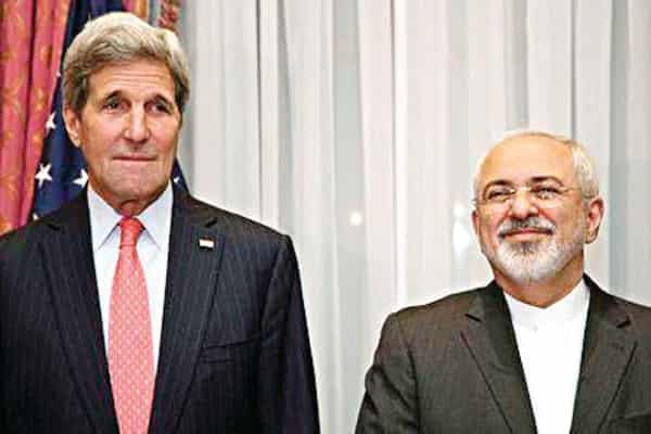U.S. Secretary of State Kerry and Iran’s Foreign Minister Zarif pose for a photograph before resuming talks over Iran’s nuclear programme in Lausanne