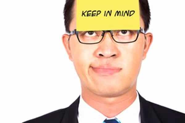 remember and keep in mind.businessman helpless watching the post it