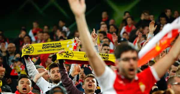 Monaco supporters with Borussia banners