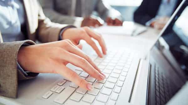 close-up-of-businesswoman-typing-on-computer-keyboard_1098-684