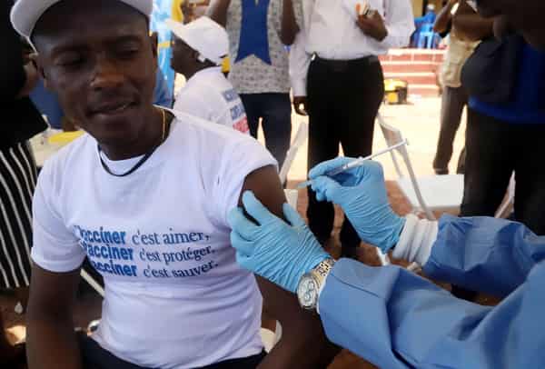 A World Health Organization worker administers a vaccination during the launch of a campaign aimed at beating an outbreak of Ebola in the port city of Mbandaka