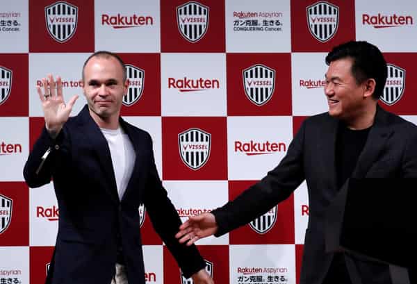 Spain midfielder Andres Iniesta and Hiroshi Mikitani, Chairman and CEO of Rakuten Inc and the owner of Vissel Kobe, attend a news conference to announce signing for J-League side Vissel Kobe in Tokyo