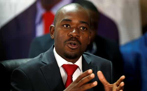 Opposition Movement For Democratic Change (MDC) party leader Nelson Chamisa gestures while addressing the media in a news conference in Harare