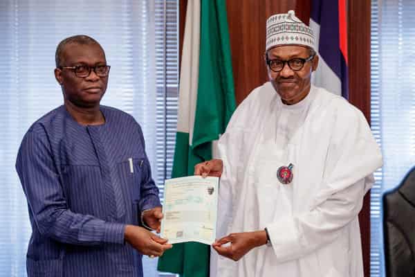 Buhari receiving WASC certificate from WAEC