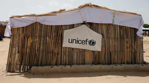 FILE PHOTO: UNICEF logo banner is seen hanging on a makeshift school at IDP camp on the outskirts of Maiduguri