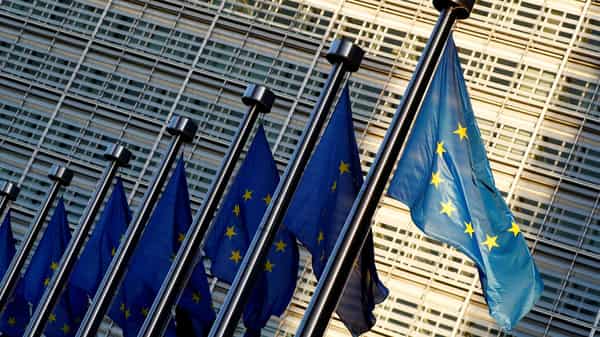 FILE PHOTO: EU flags outside the EU Commission headquarters in Brussels