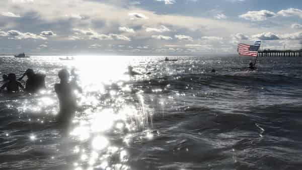 Scores Of Swimmers Take Icy Plunge At Annual Coney Island Polar Bear Club Swim