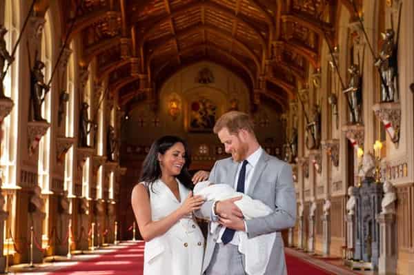 Prince Harry and Meghan Markle with their new baby Photo – PA