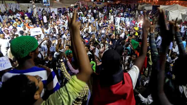 FILE PHOTO: Sudanese protesters attend a demonstration along the streets of Khartoum