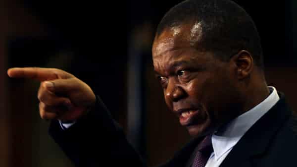 Reserve Bank of Zimbabwe (RBZ) Governor John Mangudya gestures as he delivers his 2018 Monetary Policy Statement in Harare