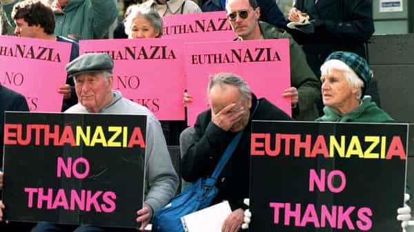 Anti-euthanasia protesters demonstrate with banners in Melbourne, July 1, the day the world’s first ..