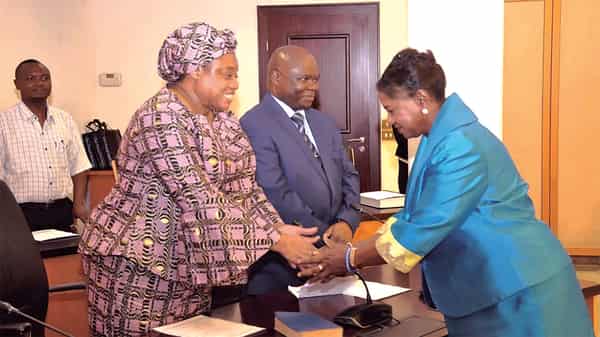 Mummy Joy Muoka shaking hands
