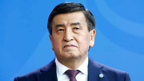 German Chancellor Angela Merkel and Kyrgyzstan’s President Sooronbay Jeenbekov address the media at the Chancellery in Berlin