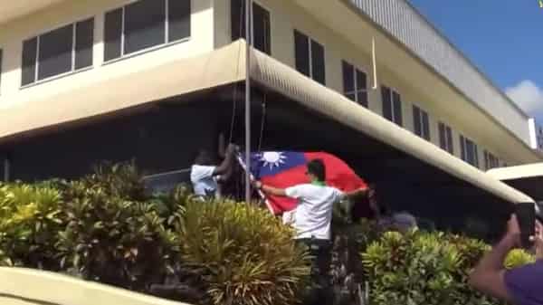 The Republic of China flag is lowered at the Taiwan embassy in Honiara