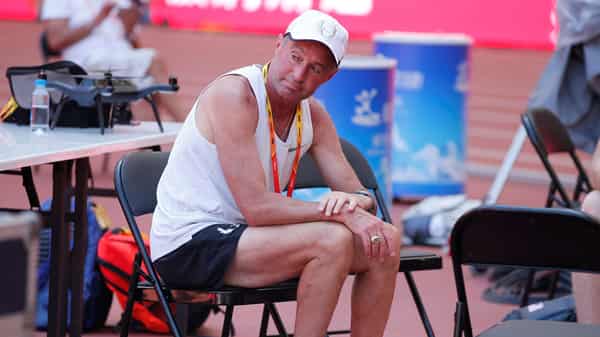FILE PHOTO: Coach Alberto Salazar sits inside the Bird’s Nest Stadium at the Wold Athletics Championships in Beijing