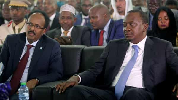 Somalia’s newly elected President Mohamed Abdullahi Farmaajo and Kenya’s President Uhuru Kenyatta listen to speeches during the inauguration ceremony in Somalia’s capital Mogadishu