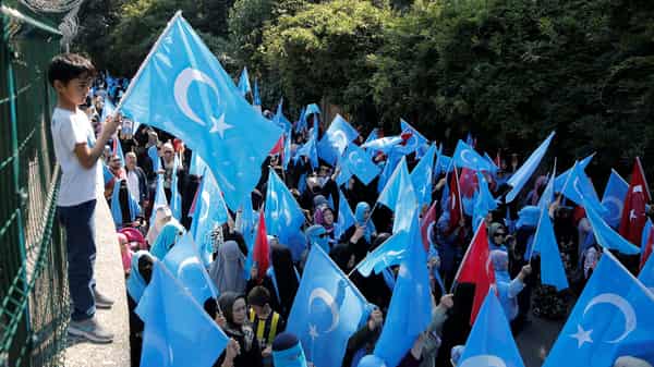 Ethnic Uighur demonstrators attend a protest against China in front of the Chinese Consulate in Istanbul
