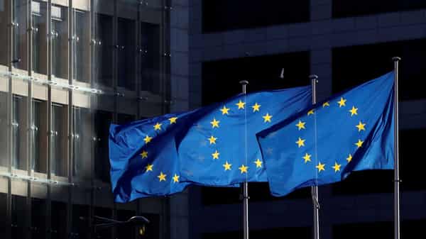 FILE PHOTO: European Union flags fly outside the European Commission headquarters in Brussels
