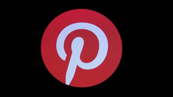 Screens display the company logo for Pinterest Inc. during the company’s IPO on the front of the NYSE in New York