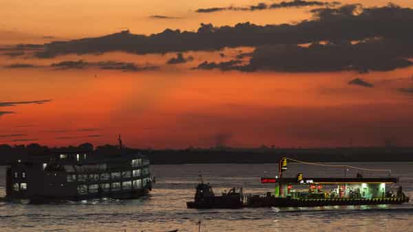 A floating Atem petrol station for small and medium vessels is seen in the middle of the Rio Negro river, near the Port of Panair in Manaus