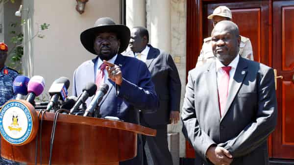 South Sudan’s President Kiir speaks during news statement with former VP and rebel leader Machar after their meeting Juba