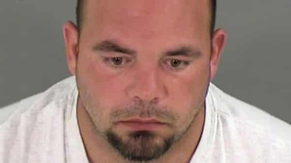 Rogers poses in jail booking photo in Henrico County