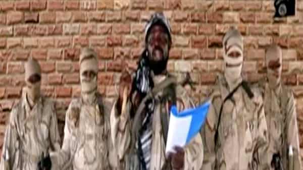 FILE PHOTO: Boko Haram leader Abubakar Shekau speaks in front of guards in an unknown location in Nigeria
