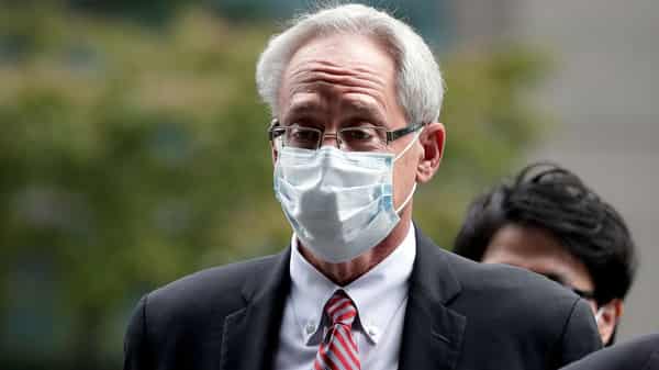 Greg Kelly, former representative director of Nissan Motor Co., arrives for the first trial hearing at the Tokyo District Court in Tokyo