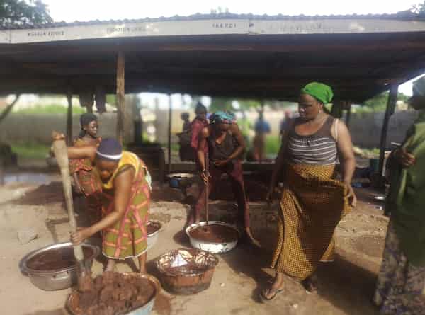 Kaiama women shea collectors, manually processing the grinded shea nuts. Photo Credit: Elfredah Kevin-Alerechi