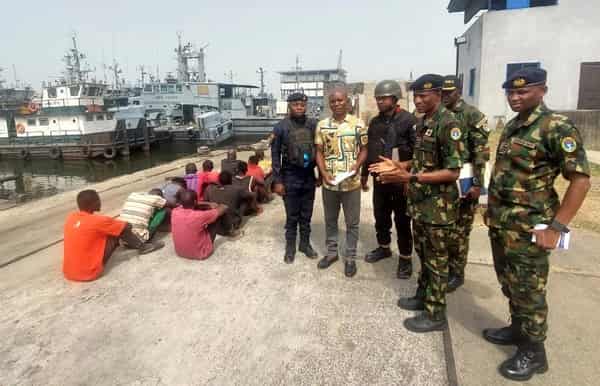 Base-Operations-Officer-Nigeria-Navy-Ship-NNS-Pathfinder-Port-Harcourt-Cdr.-Said-Kabir-handing-over-11-suspected-oil-thieves-to-NSCDC-in-Port-Harcourt-on-Monday