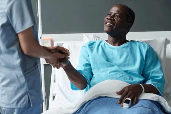 elderly-patient-talking-nurse-ward