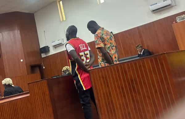 The defendants at the dock yesterday