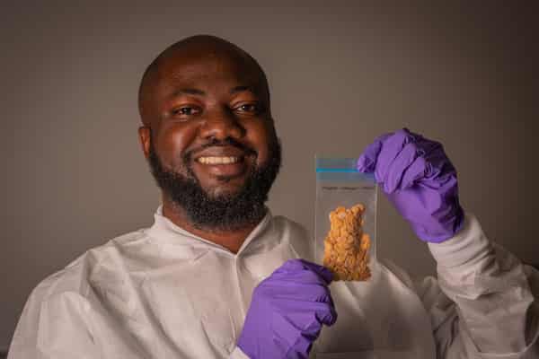 Temidayo holding Egusi specimen (Image Credit_ Jaguar Space_Ivan Castro Guatemala).jpg (1)