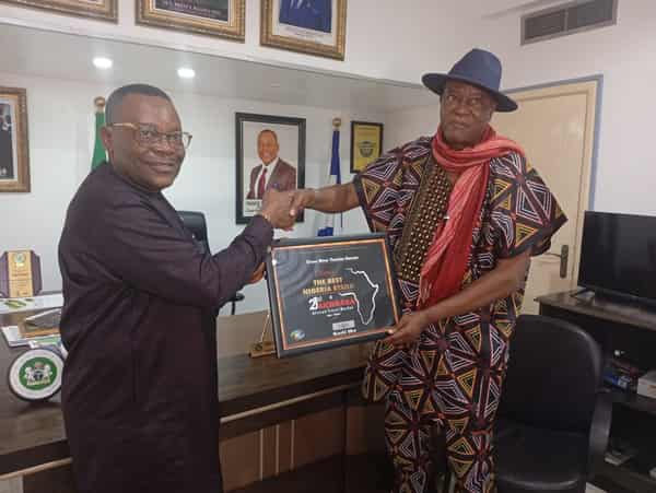 The Managing Director, Cross River State Tourism Bureau, Prince Ekpenyong Ojoi, receiving the award from the organiser of Akwaaba, Mr Ikechi Uko, during the presentation in Calabar, at the weekend