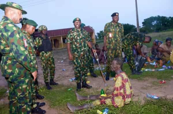 Officers of the Nigerian army with some of the victims copy