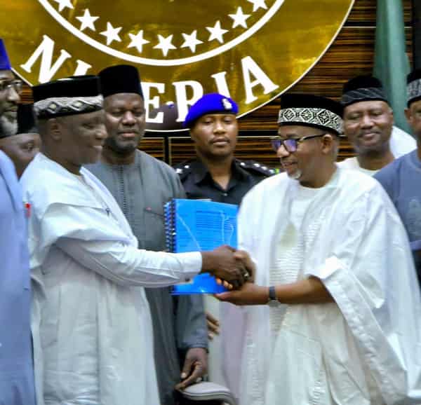 The image captures the moment when Governor Bala Mohammed of Bauchi State, Nigeria, signed laws creating new emirates and a chiefdom.