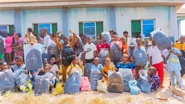 Group photo of children with their gifts