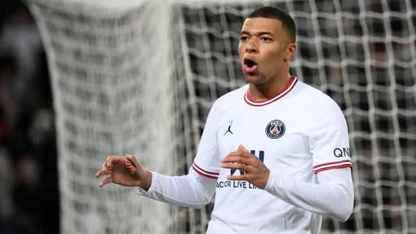 Real Madrid’s French forward #09 Kylian Mbappe reacts following the UEFA Champions League football
