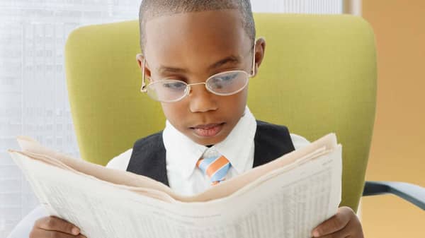 033114-b-real-finances-kids-money-spending-reading-newspaper