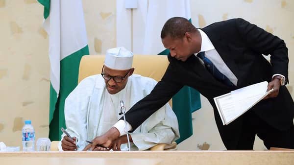 Buhari signs agreements