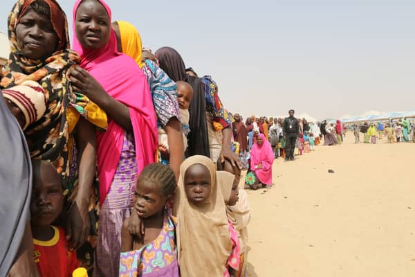 Families displaced by the Boko Haram insurgency line up for food being distributed by International Medical Corps in northeast Nigeria’s Borno state