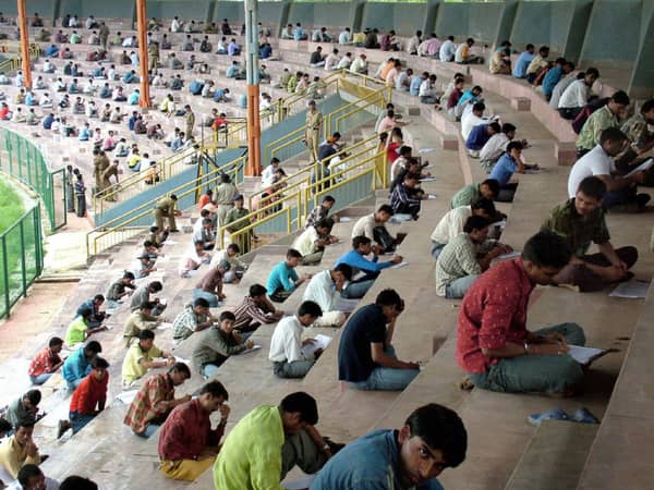 Indian youths take a written entrance ex