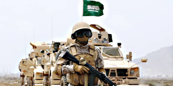 A member of the Saudi forces stands to a…A member of the Saudi