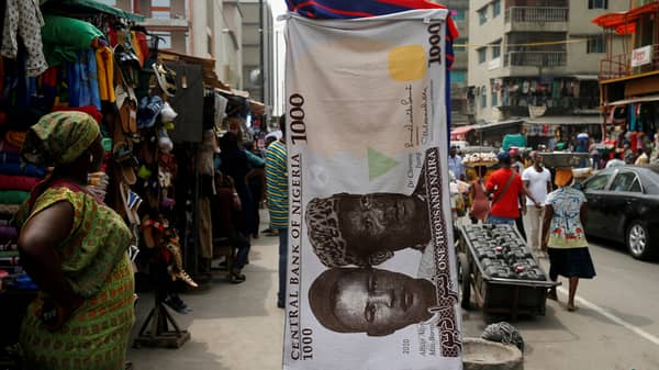 FILE PHOTO: A towel with a print of the Nigerian naira is displayed for sale at a street market in the central business district in Nigeria’s commercial capital Lagos