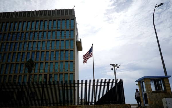 A security officer stands next to the U.S. Embassy in Havana