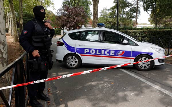 French police secure a street after a man killed two persons and injured an other in a knife attack in Trappes, near Paris