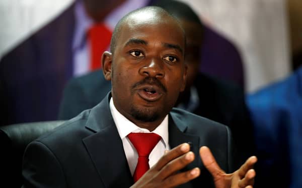 Opposition Movement For Democratic Change (MDC) party leader Nelson Chamisa gestures while addressing the media in a news conference in Harare