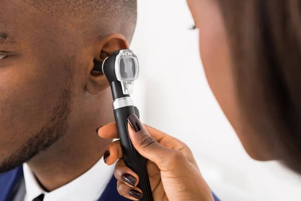 Doctor inspecting patient’s ear Source Medical News Today