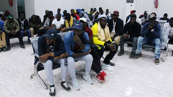 Migrants from Mali wait at Misrata airport before their return to their countries, in Misrata